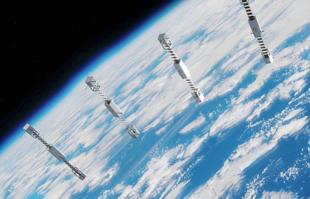 Four modern satellites in low Earth orbit above cloud-covered oceans and the Earth’s atmospheric limb